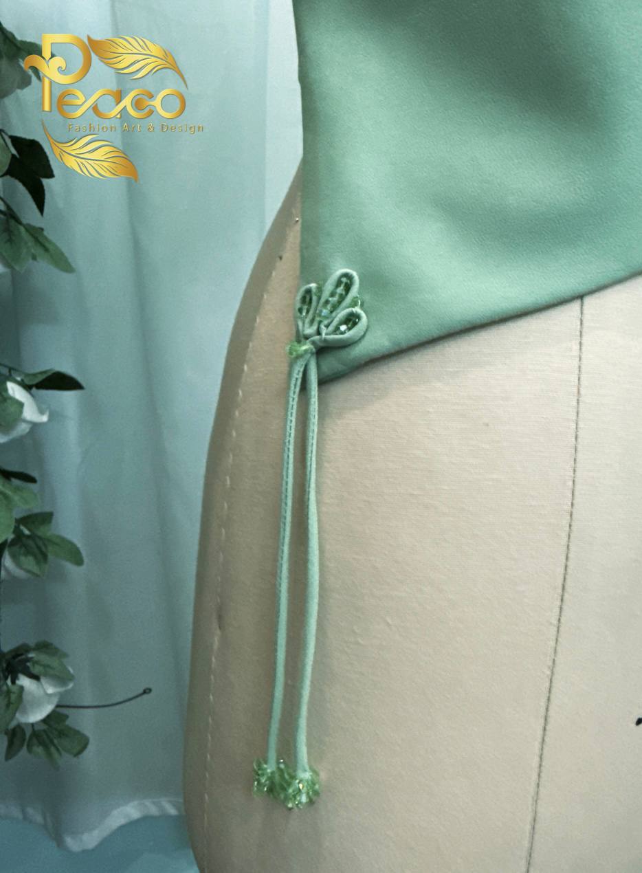Asymmetric Wrap Blouse with Tassel Detail