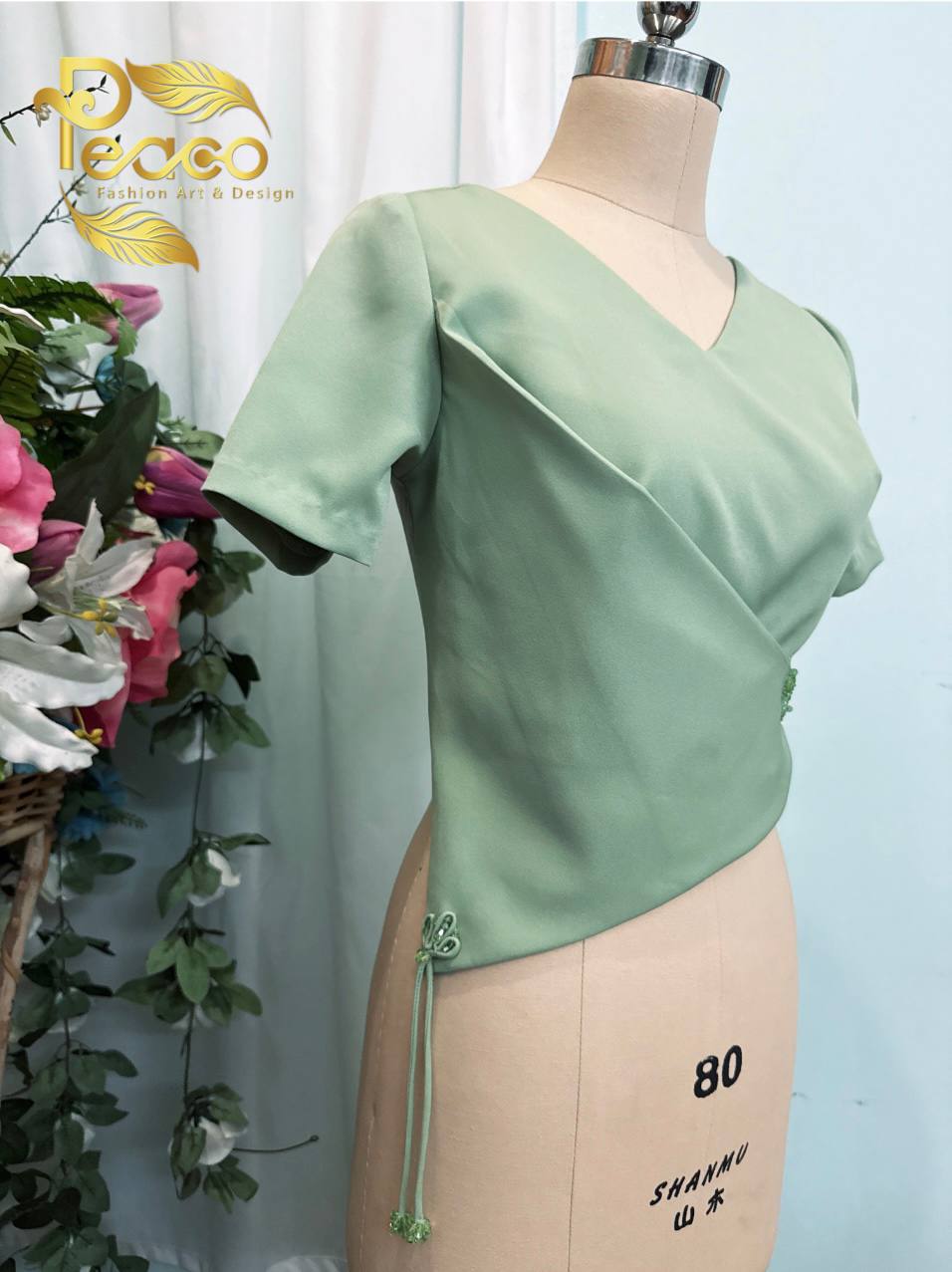 Asymmetric Wrap Blouse with Tassel Detail